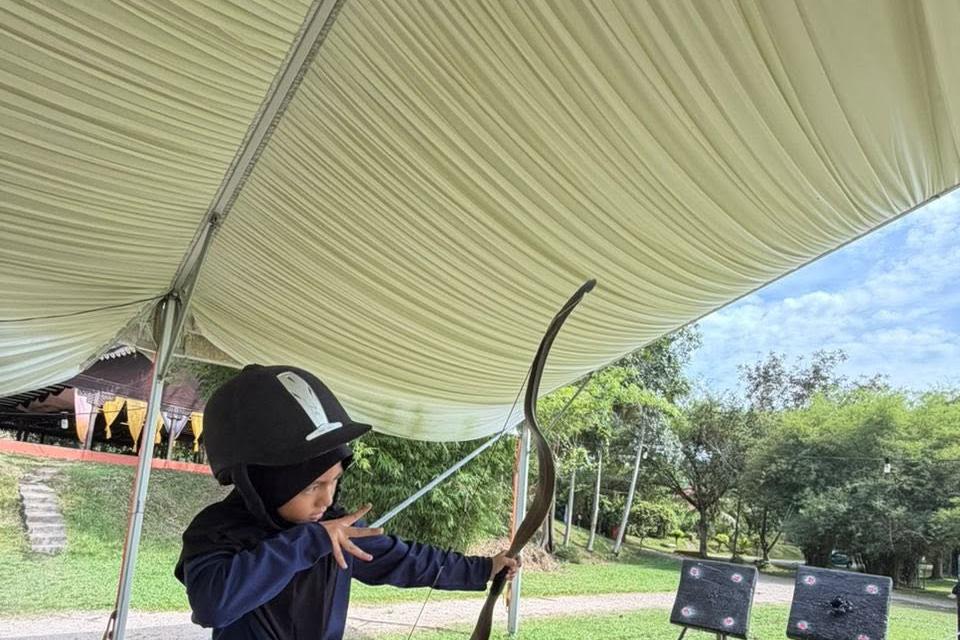 QIIS student taking part in archery