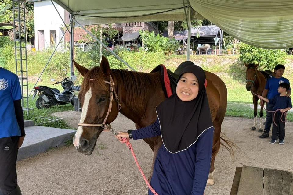 QIIS student taking part in horse riding